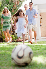 Image showing Happy family playing soccer and having fun