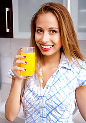 Image showing Woman Drinking Orange Juice