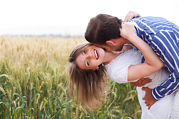 Image showing Happy young Couple hugging and kissing eachother