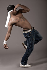 Image showing Dancer with spider tatoo on his chest performing dance