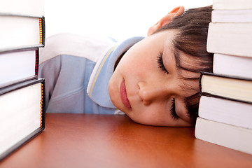 Image showing School boy sleeping on table