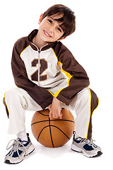 Image showing Cute kid sitting on the ball