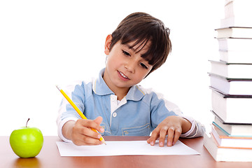 Image showing Cute young boy busy in drawing