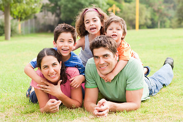 Image showing Happy family lying in the park