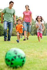 Image showing Family playing football in the park