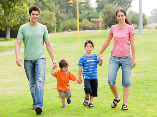 Image showing Happy family walking in the park