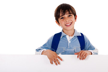 Image showing Boy standing behind the blank board