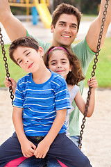 Image showing kids having fun with their father