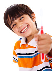 Image showing Happy young boy showing the toothbrush