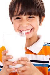 Image showing Young kid with glass of milk
