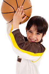 Image showing Portrait of a kid throwing ball at camera