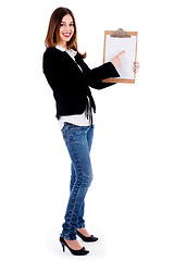 Image showing Business woman pointing on a blank clip board