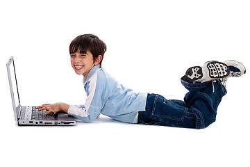 Image showing Young boy surfing on his laptop