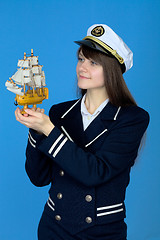 Image showing Portrait of the woman in a sea cap with the ship