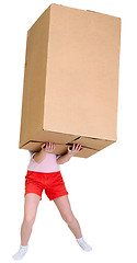 Image showing Girl holding very heavy brown cardboard box