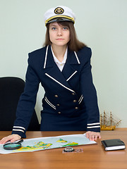 Image showing Woman in uniform with geographic map