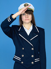 Image showing Girl in a sea uniform salutes