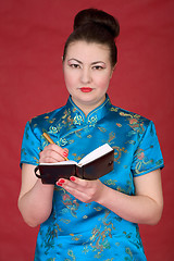 Image showing Japanese girl with notebook