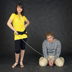 Image showing Guy chained in a chain and girl