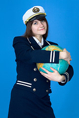 Image showing Girl in uniform embrace globe