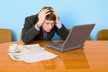 Image showing Businessman on a workplace with the laptop