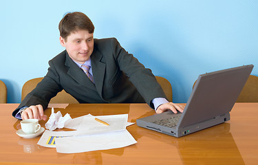 Image showing Businessman on a workplace with the laptop