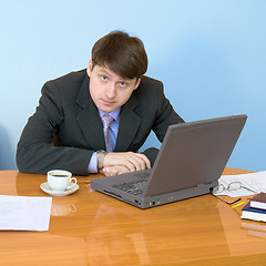 Image showing Businessman on a workplace with the laptop