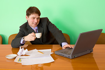 Image showing Businessman on a workplace with the laptop