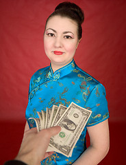 Image showing Japanese girl and dollars