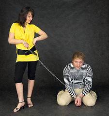 Image showing Guy chained in a chain and girl