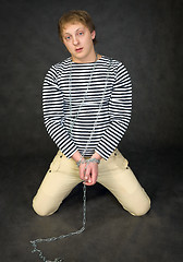 Image showing Young man shackled 