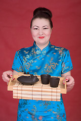 Image showing Japanese girl with teapot