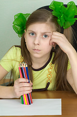 Image showing Girl with colour pencils in hands