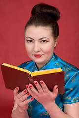 Image showing Japanese girl reading book
