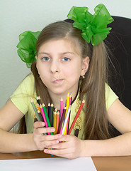 Image showing Girl with color pencils in hands