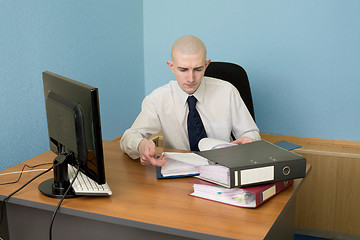 Image showing Bookkeeper on a workplace at office