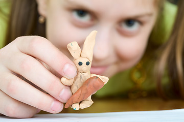 Image showing Girl with a plasticine rabbit