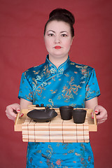 Image showing Japanese girl with tea-tray