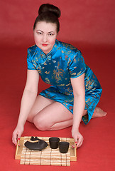 Image showing Japanese girl with tea-tray