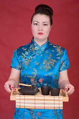 Image showing Japanese girl with tea-tray