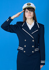 Image showing Girl in a sea uniform salutes