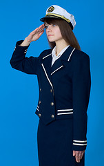 Image showing Girl in a sea uniform salutes