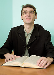 Image showing Guy in eyegasses reads the book