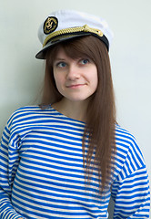 Image showing Beautiful girl in a stripped vest and cap