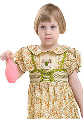 Image showing Little girl with blowing off balloon