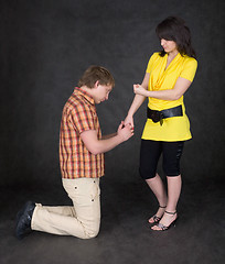 Image showing Young woman to shake one's fist at youth