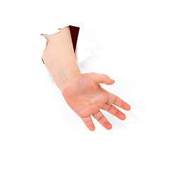 Image showing Child's hand stick out from hole