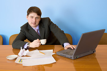 Image showing Businessman on a workplace with the laptop