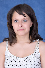 Image showing Amazed girl on a blue background