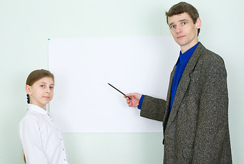 Image showing Teacher explains something to the schoolgirl